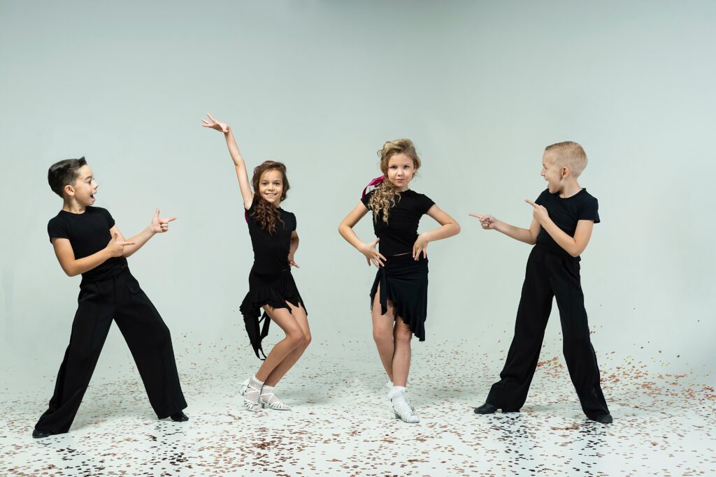 A,Two,Curly-haired,Girls,And,Two,Boys,Engaged,In,Ballroom